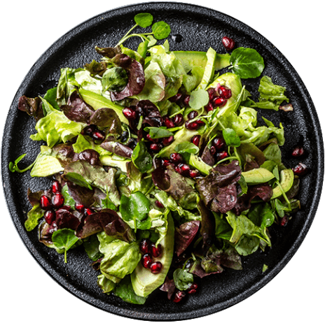 lettuce-salad-with-pomegranate-on-black-plate-top-2022-02-02-03-55-51-utc_isolated.png